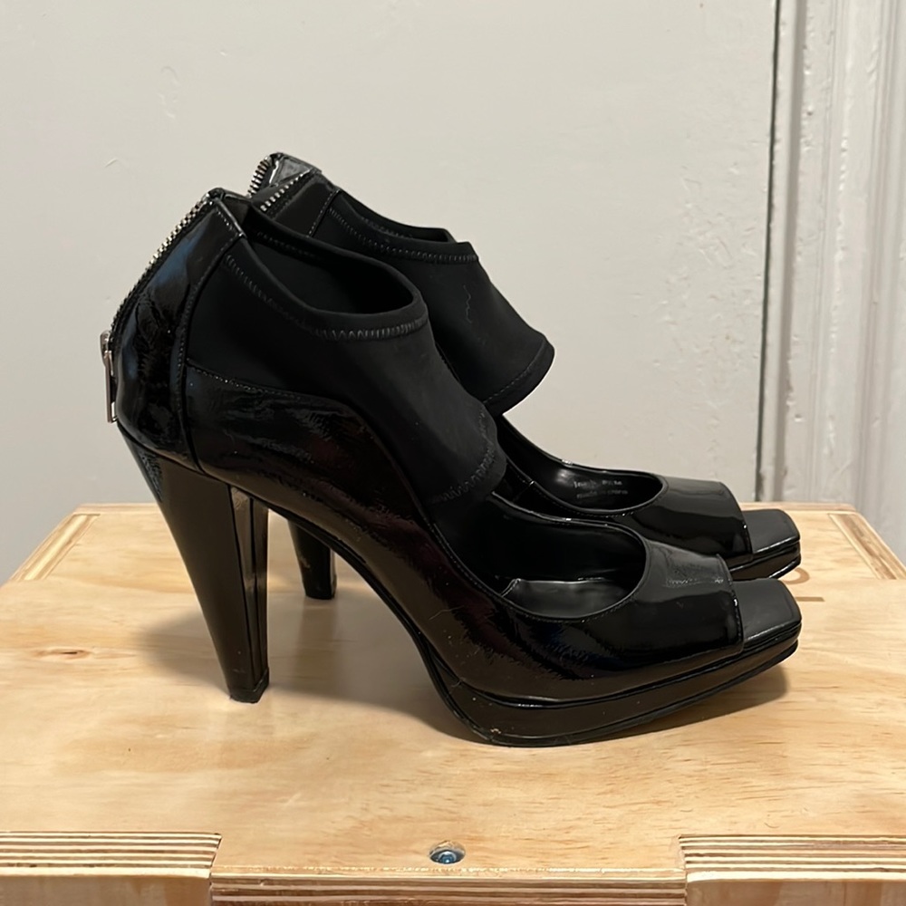 Black patent heels with stretchy ankle straps. Size 8.5.